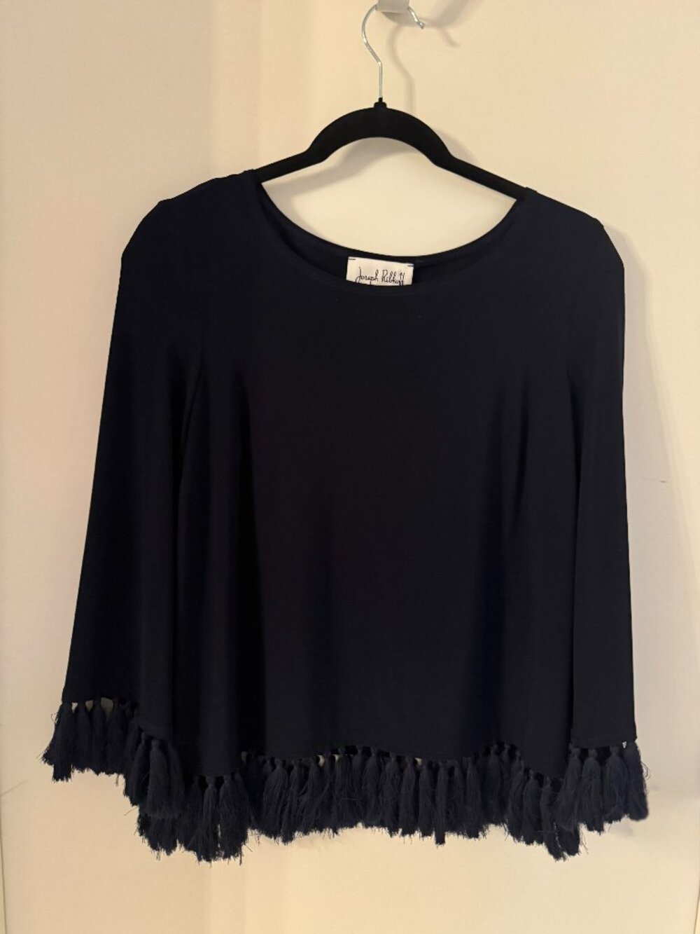 Joseph Ribkoff silky top size M with distinctive fringe along cuffs and hem